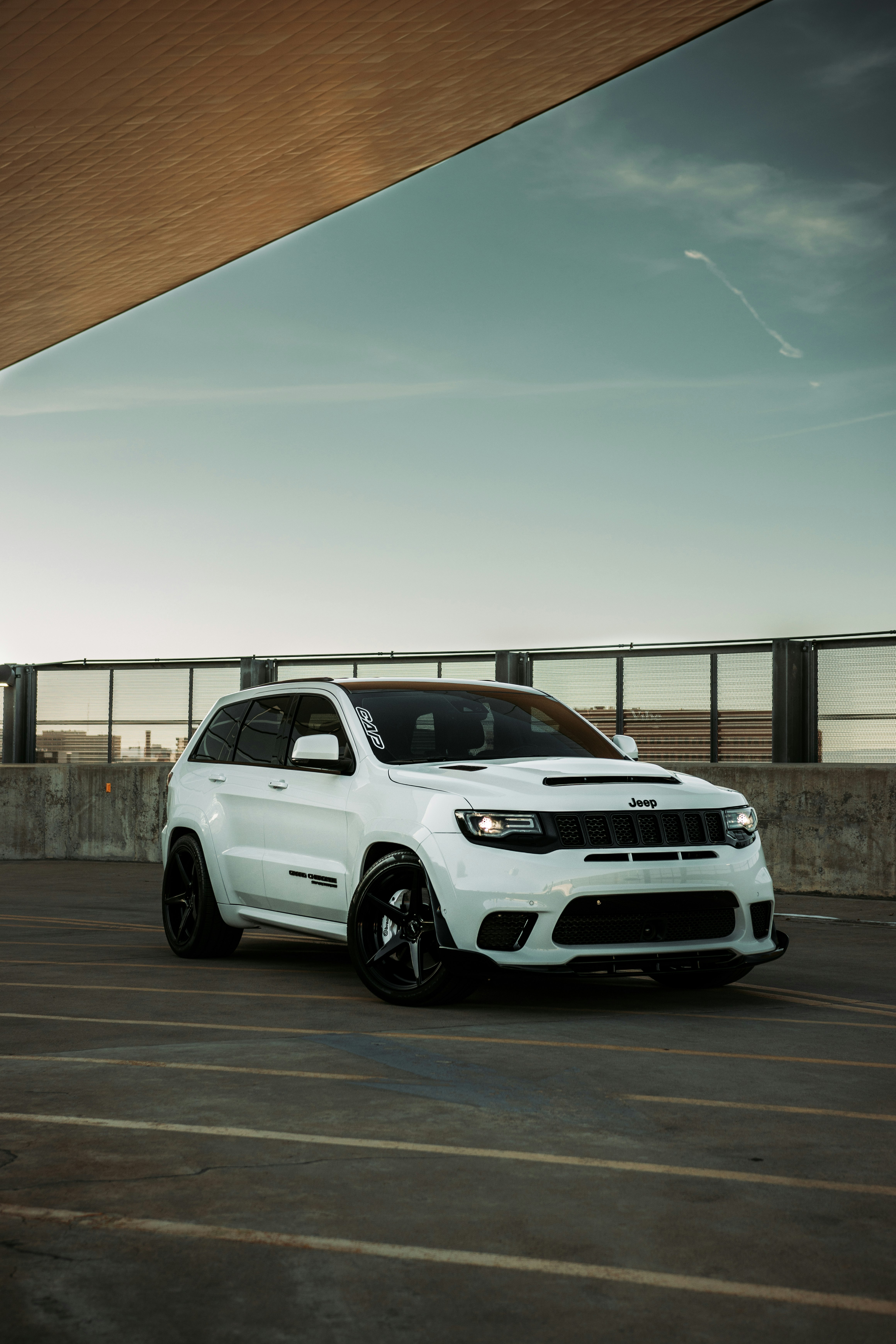 white honda suv parked on gray concrete floor during daytime